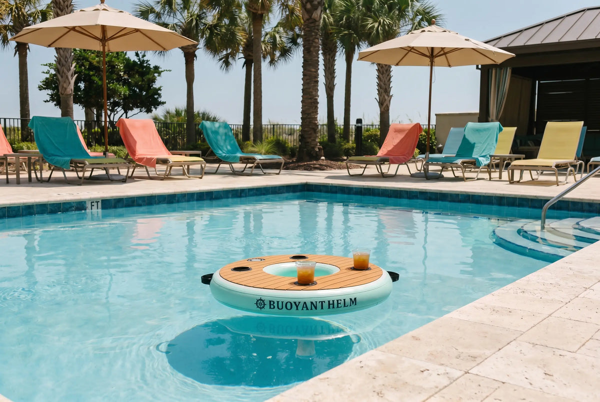 Pool area with lounge chairs, umbrellas, and a Buoyant Helm product in the water.